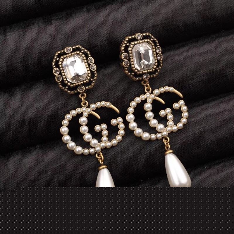 G*u*i earrings
